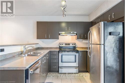 102 - 1810 Walker'S Line, Burlington (Palmer), ON - Indoor Photo Showing Kitchen With Stainless Steel Kitchen With Double Sink