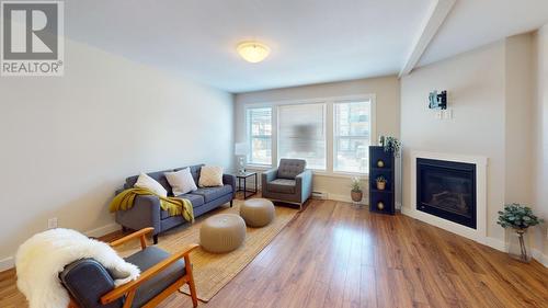 119 10303 112 Street, Fort St. John, BC - Indoor Photo Showing Living Room With Fireplace