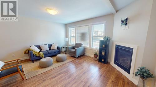 119 10303 112 Street, Fort St. John, BC - Indoor Photo Showing Living Room With Fireplace