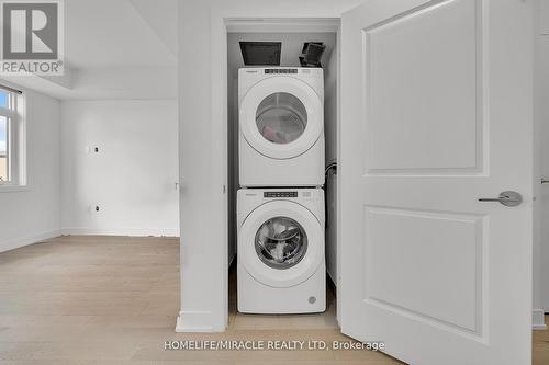 230 - 1062 Douglas Mccurdy Common N, Mississauga, ON - Indoor Photo Showing Laundry Room