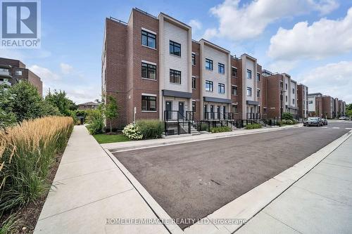 230 - 1062 Douglas Mccurdy Common N, Mississauga, ON - Outdoor With Facade