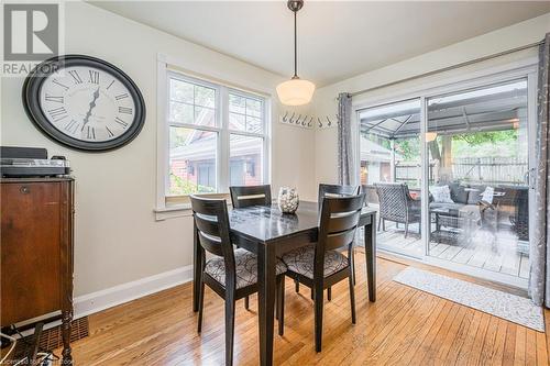 Dining room with light hardwood / wood-style floors and a wealth of natural light - 48 Dane Street, Kitchener, ON - Indoor Photo Showing Dining Room