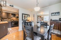 Dining area with light hardwood / wood-style floors and sink - 