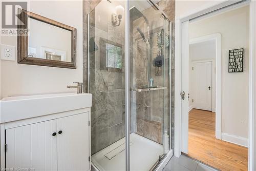 Bathroom featuring tile patterned flooring, vanity, and walk in shower - 48 Dane Street, Kitchener, ON - Indoor Photo Showing Bathroom