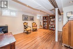 Living area with light hardwood / wood-style flooring - 