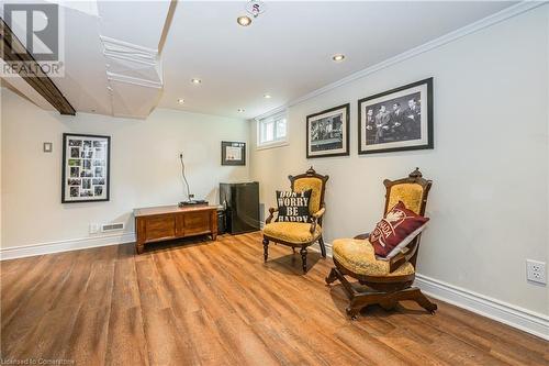 Sitting room with hardwood / wood-style flooring and ornamental molding - 48 Dane Street, Kitchener, ON - Indoor Photo Showing Other Room