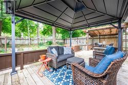 Deck with a gazebo and an outdoor living space - 