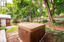 View of yard featuring a hot tub - 