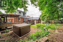 View of yard featuring a gazebo and a hot tub - 