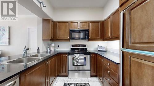 309 - 2 Edith Drive, Toronto, ON - Indoor Photo Showing Kitchen With Double Sink