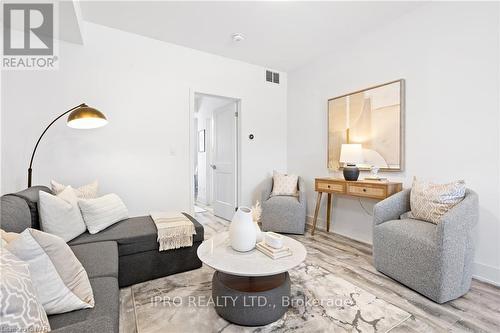 214 - 6065 Mcleod Road, Niagara Falls, ON - Indoor Photo Showing Living Room