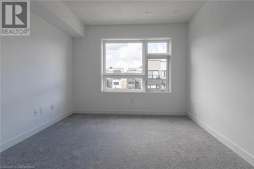 Carpeted empty room with a textured ceiling - 1121 Cooke Boulevard Unit# 7, Burlington, ON - Indoor Photo Showing Other Room