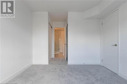 Unfurnished bedroom with light carpet and a closet - 1121 Cooke Boulevard Unit# 7, Burlington, ON - Indoor Photo Showing Other Room