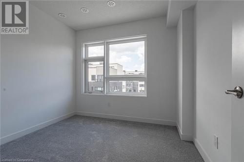 Spare room with carpet floors and a textured ceiling - 1121 Cooke Boulevard Unit# 7, Burlington, ON - Indoor Photo Showing Other Room