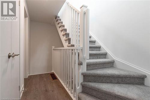 Stairs with hardwood / wood-style flooring - 1121 Cooke Boulevard Unit# 7, Burlington, ON - Indoor Photo Showing Other Room