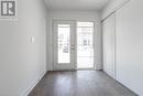 Doorway to outside featuring hardwood / wood-style floors and a healthy amount of sunlight - 1121 Cooke Boulevard Unit# 7, Burlington, ON  - Indoor Photo Showing Other Room 