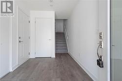 Entrance foyer with wood-type flooring - 