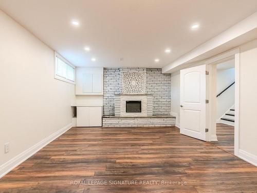 Bsmt-60 Risdon Crt, Toronto, ON - Indoor Photo Showing Other Room With Fireplace