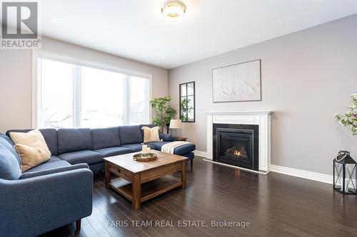 3096 Orion Boulevard, Orillia, ON - Indoor Photo Showing Living Room With Fireplace