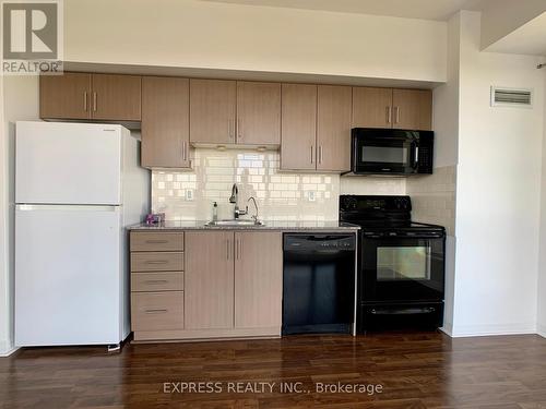 2205 - 30 Herons Hill Way, Toronto, ON - Indoor Photo Showing Kitchen