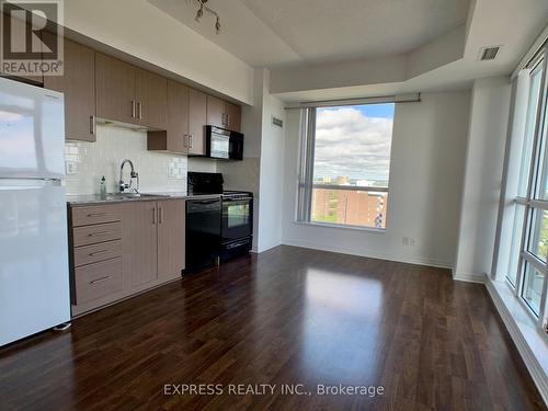 2205 - 30 Herons Hill Way, Toronto, ON - Indoor Photo Showing Kitchen