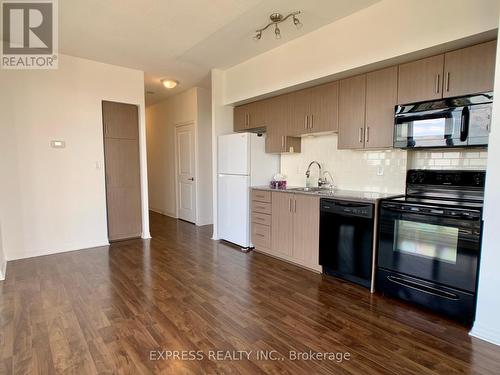 2205 - 30 Herons Hill Way, Toronto, ON - Indoor Photo Showing Kitchen