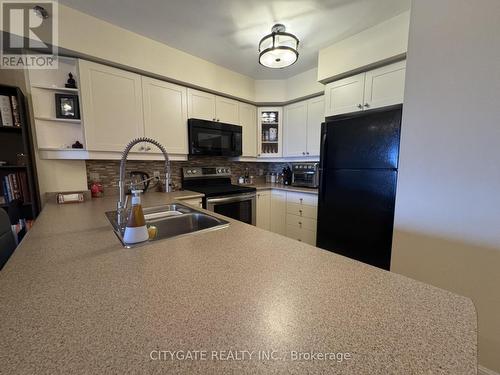 413 - 3060 Rotary Way, Burlington, ON - Indoor Photo Showing Kitchen With Double Sink