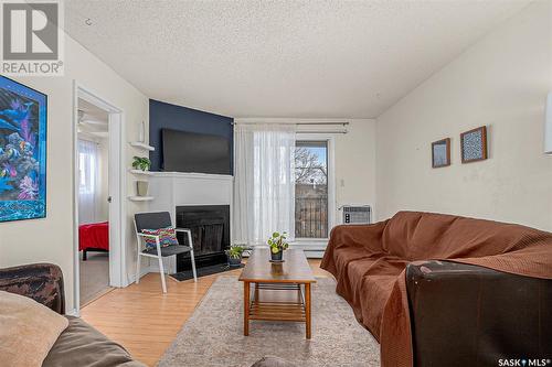 314B 4040 8Th Street, Saskatoon, SK - Indoor Photo Showing Living Room With Fireplace