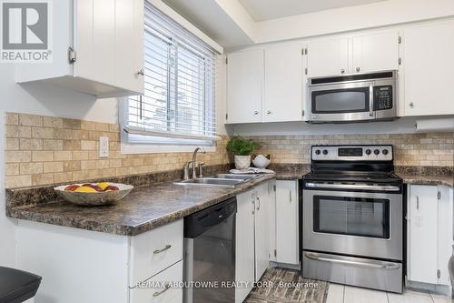 100 - 11 Harrisford Street, Hamilton, ON - Indoor Photo Showing Kitchen With Stainless Steel Kitchen With Double Sink