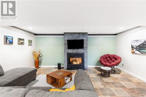 4450 Park Avenue, Hanmer, ON - Indoor Photo Showing Living Room With Fireplace