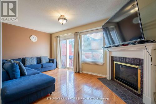 Upper - 3873 Densbury Drive, Mississauga, ON - Indoor Photo Showing Living Room With Fireplace