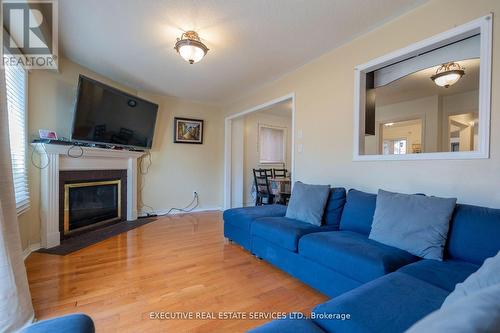 Upper - 3873 Densbury Drive, Mississauga, ON - Indoor Photo Showing Living Room With Fireplace