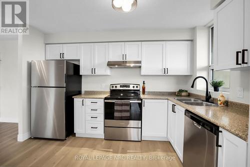 1004 - 81 Scott Street, St. Catharines (443 - Lakeport), ON - Indoor Photo Showing Kitchen With Double Sink