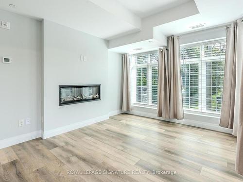 301-153 Wilson St W, Hamilton, ON - Indoor Photo Showing Living Room With Fireplace