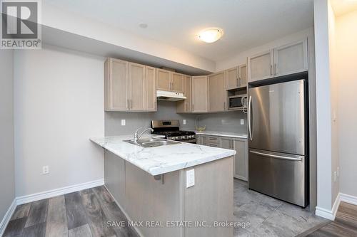 99 - 445 Ontario Street, Milton, ON - Indoor Photo Showing Kitchen With Double Sink