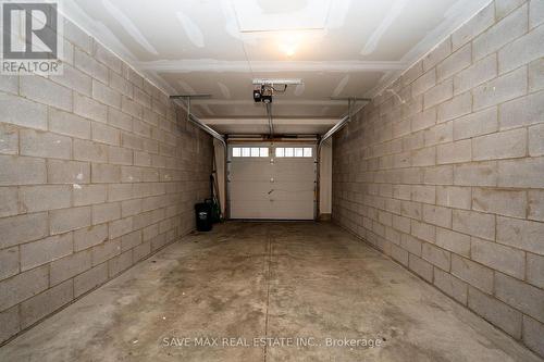 99 - 445 Ontario Street, Milton, ON - Indoor Photo Showing Garage