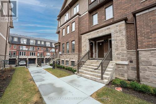 99 - 445 Ontario Street, Milton, ON - Outdoor With Facade