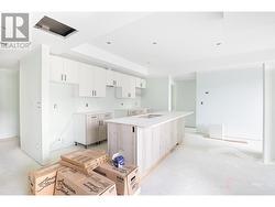 Photo from one of our larger 2 bedroom designs, which show cases the same colour scheme of Unit 101. Size and layout of kitchen may be different. - 