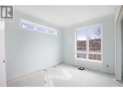 Photo from one of our larger 2 bedroom designs, which show cases the same colour scheme of Unit 101. Size and layout of windows and the view may be diffent. - 215 Royal Avenue Unit# 101, Kamloops, BC - Indoor Photo Showing Other Room