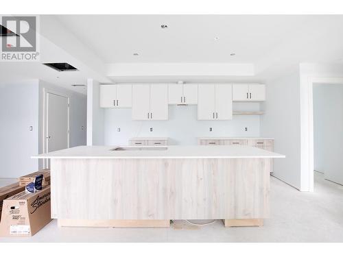 Photo from one of our larger 2 bedroom designs, which show cases the same colour scheme of Unit 101. Size and layout of kitchen may be different. - 215 Royal Avenue Unit# 101, Kamloops, BC - 