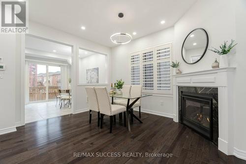 3067 Max Khan Boulevard, Oakville, ON - Indoor Photo Showing Dining Room With Fireplace