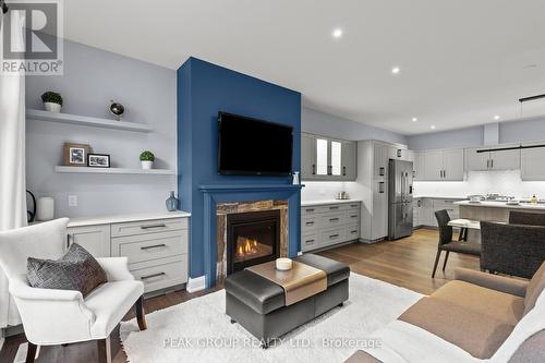 2 - 9245 Shoveller Drive, Niagara Falls (219 - Forestview), ON - Indoor Photo Showing Living Room With Fireplace