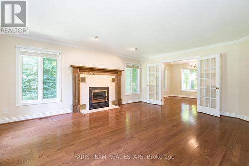 2087 Wilkinson Street, Innisfil, ON - Indoor Photo Showing Living Room With Fireplace