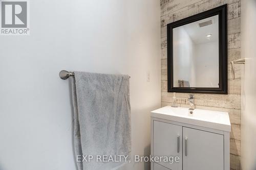 2 piece bathroom off entrance foyer/ mudroom - 85 Dufferin Street, Stratford, ON - Indoor Photo Showing Bathroom