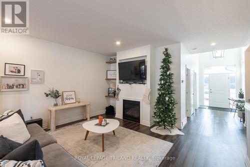 102 - 9861 Glendon Drive, Middlesex Centre, ON - Indoor Photo Showing Living Room With Fireplace