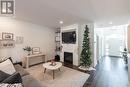 102 - 9861 Glendon Drive, Middlesex Centre, ON  - Indoor Photo Showing Living Room With Fireplace 