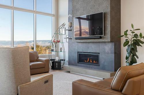 484 Sparrow Hawk Court, Kelowna, BC - Indoor Photo Showing Living Room With Fireplace