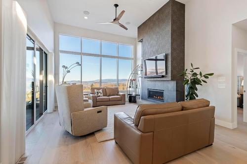 484 Sparrow Hawk Court, Kelowna, BC - Indoor Photo Showing Living Room With Fireplace