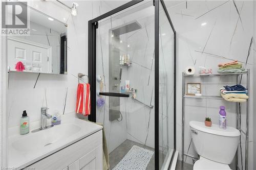 Bathroom featuring decorative backsplash, walk in shower, vanity, tile walls, and toilet - 349 Kipling Avenue, Etobicoke, ON - Indoor Photo Showing Bathroom