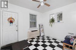 Foyer entrance with ceiling fan and radiator - 